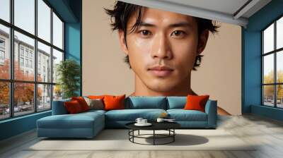 Close up of handsome Japanese male model with glowy skin and modern hairstyle Wall mural