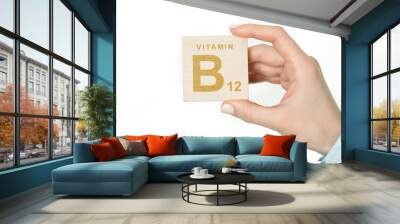 Doctor advises. Nutritionist or medical worker holds VITAMIN B sign, healthy lifestyle concept. Wall mural