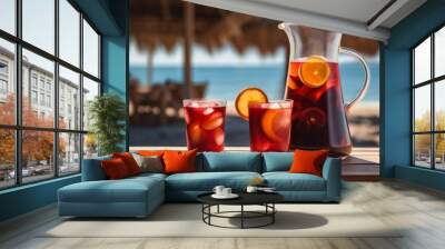 Jug and glasses full of easy traditional red sangria on the table Wall mural