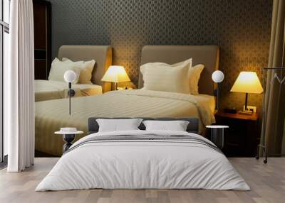 Modern generic bedroom interior, two single beds with clean white sheets and lamps on the nightstand Wall mural