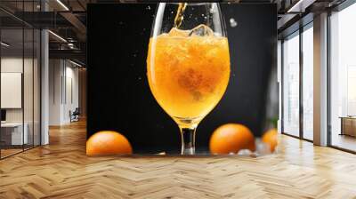 Refreshing ice cold orange juice in the glass Wall mural