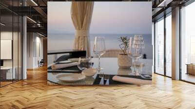 Restaurant table setting with sea view Wall mural