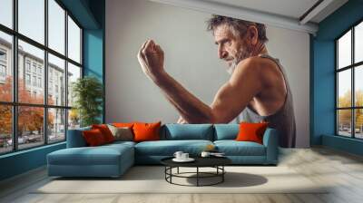 Senior man in fighting position Wall mural