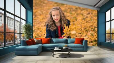 Autumn girl happy with colorful fall leaves falling Wall mural