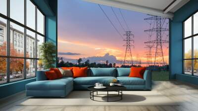 Group silhouette of transmission towers (power tower, electricity pylon, steel lattice tower) at twilight in US. Texture high voltage pillar, overhead power line, industrial background. Panorama style Wall mural