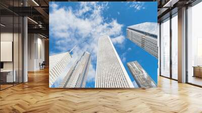 Low angle view of Chicago modern skylines from central business district under cloud blue sky Wall mural