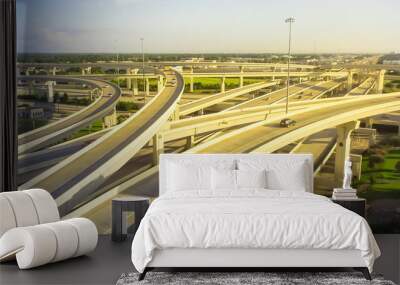 Panorama horizontal aerial view massive highway intersection, stack interchange blue sky in Houston, Texas, USA. Elevated road junction overpass, five-level freeway carry heavy rush hour traffic Wall mural