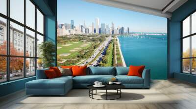 Top view of downtown Chicago tall skylines with busy traffic on U.S. Highway 41f rom Grant Park. Tranquil Michigan Lake and green trees along Lake Shore Drive, row of docked boats and yachts Wall mural