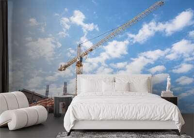 Working crane and safety net on modern office and residential building under construction against cloud blue sky in Downtown New Orleans, Louisiana, US. Red grid prevent objects falling from height. Wall mural