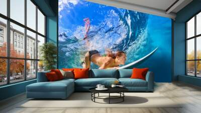 Active girl in bikini in action. Surfer woman with surf board dive underwater under breaking big wave. Healthy lifestyle. Water sport, extreme surfing in adventure camp on family summer beach vacation Wall mural