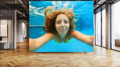 Funny portrait of teenager girl. Swim, dive in blue pool with fun - jumping deep down underwater. Healthy family lifestyle, kids water sports activity, swimming lesson. Wall mural