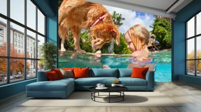 Little child play with fun and train golden labrador retriever puppy in swimming pool - jump and dive underwater to retrieve shell. Kids games with family pets and popular dog breeds like companion. Wall mural