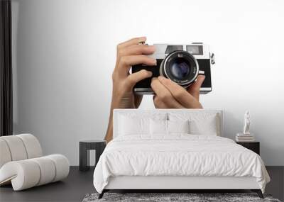 Female hands holding an old vintage camera with no background Wall mural