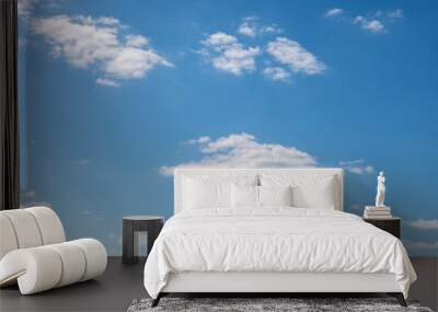 Blue sky with white clouds as a background Wall mural