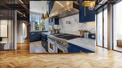 A classic kitchen with navy cabinets, white marble countertops, and brass fixtures, featuring an elegant stainless steel stove and oven under hanging pendant lights above the island Wall mural