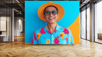 A man wearing a yellow hat and a blue floral shirt is smiling. The image has a bright and cheerful mood Wall mural