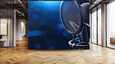 Dark blue background, studio microphone. for recording, broadcasting or podcasting studio needs, offers enough copy space for additional text or graphics. Wall mural