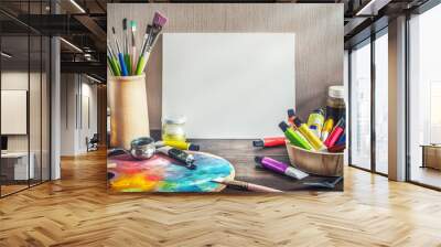 Painter equipment in a artist studio: empty canvas, tube of oil paint, art brushes, palette knife lying.  Artist workshop background. Wall mural