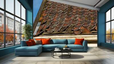 Roof tiles of an old abandoned house. Wall mural