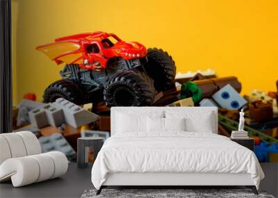 the monster car on the brick toy on orange background Wall mural