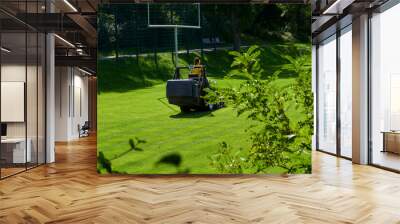 care of the football field on a lawn mower Wall mural