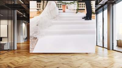 Bride and groom stand at the wedding ceremony Wall mural