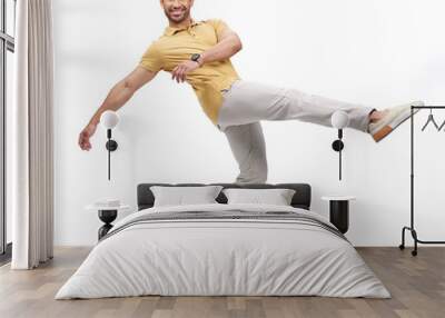 Dance, movement and portrait of man in studio for happiness, energy and performance with smile. Creative, happy and male person dancing, moving and in action pose for mockup on white background Wall mural