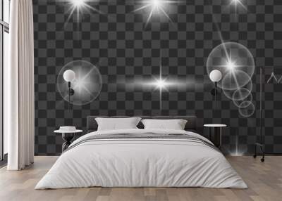 Realistic glare of light. Collection of white stars with glare on a dark transparent background. Light vector effect. Vector illustration. Wall mural