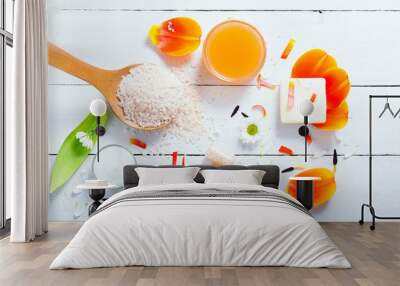 aromatherapy: orange gel and extract, bath salt, cosmetic cream, organic soap and petals on white wood Wall mural