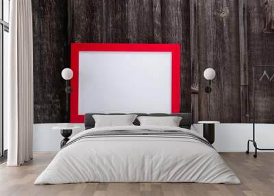 red picture frame, blank copy space, white table, weathered wooden wall Wall mural