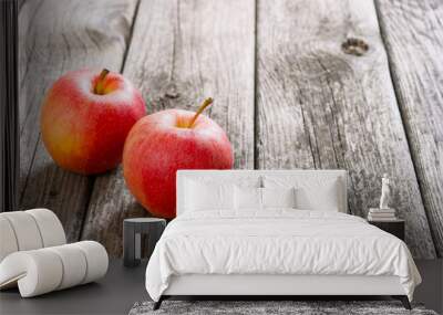 two apples on old wood table Wall mural