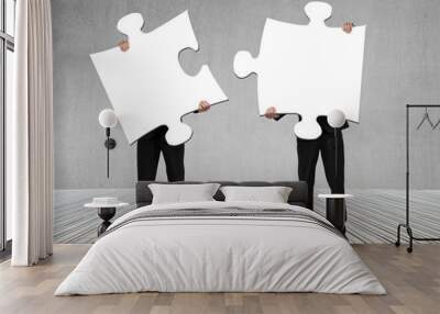 businessmen holding two puzzles to connect Wall mural