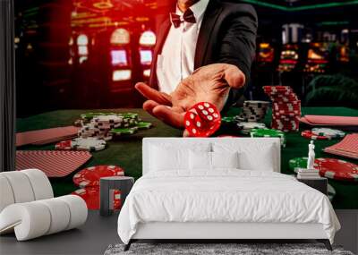 Gambling concept. Close up of male hand throwing dice at casino, gambling club. Сasino chips or Casino tokens, poker cards, gambling man spending time in games of chance Wall mural