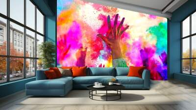 Holiday Holi concept.An explosion of multi-colored paint, bright vibrant pigments. Noisy dust and powder texture, flicker and shimmer noise. Background with hands for design Wall mural