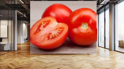 Close up of fresh tomatoes in drops of water on a wooden board Wall mural