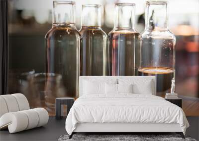 empty clean glass decanters for water in a restaurant on a bar counter Wall mural