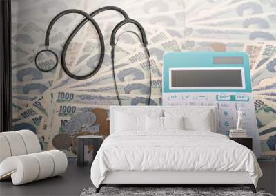 Stethoscope with calculator, Japanese currency yen bank notes and Japanese coin, Health care cost Wall mural