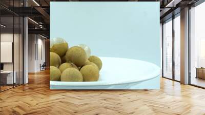 Longan fruit with a white plate In white background.  Wall mural