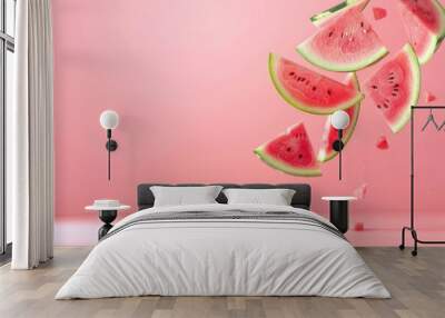 A juicy red slice of ripe watermelon isolated on a pink background Wall mural