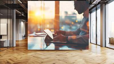 Businessman working on laptop computer in modern office, closeup. Business and technology concept Wall mural