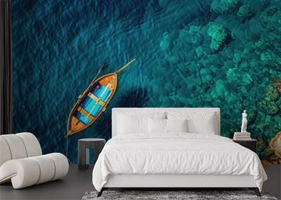 Wooden boat floats serenely on river, surrounded by blue water and nature's tranquility Wall mural