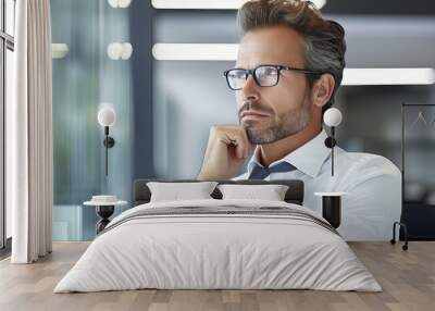 Young businessman thinking about work plan in office Wall mural