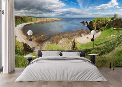 Panorama of a cliff with ancient castle in a bay with blue sky and white clouds in Dunnottar Castle, near Stonehaven, Aberdeenshire, Scotland - UK Wall mural