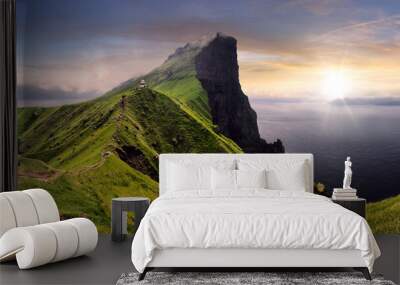 Sunset over green mountain with atlantic ocean, Faroe islands - Kallur lighthouse Wall mural