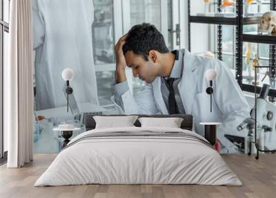 Exhausted stressed research scientists feeling tired worried about problem in chemical laboratory. Wall mural