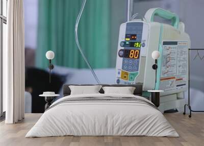 Infusion pump intravenous IV drip in the hospital with copy space background. Wall mural