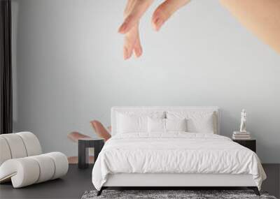 Hand model holding a cosmetic jar with a white background for cosmetic advertising Wall mural