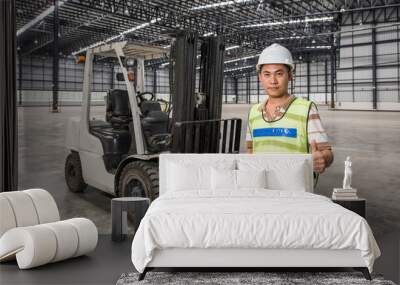 worker with a forklift in a warehouse in logistic area Wall mural