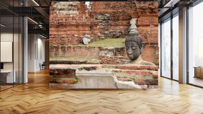 Broken buddha statue and ancient building Wall mural