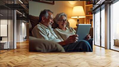 Couple sharing a joyful moment using technology together on a couch Wall mural